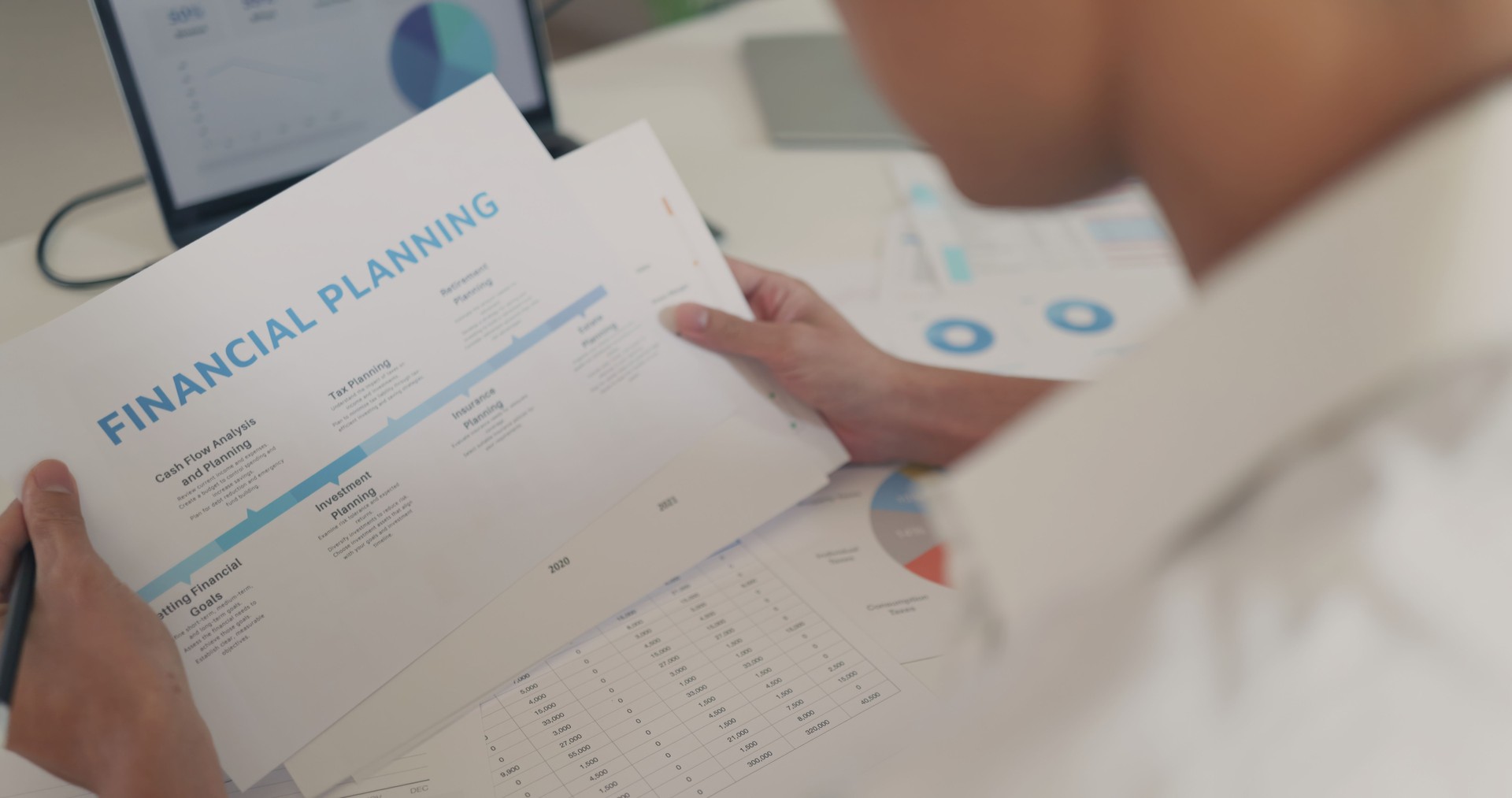 Close-up of Financial Planning Documents on Desk.